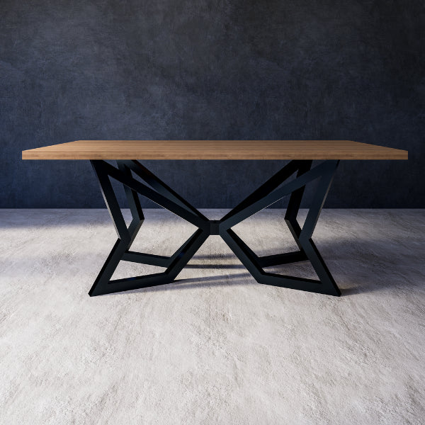 Antares dining table with wooden top and black metal legs against a grey wall