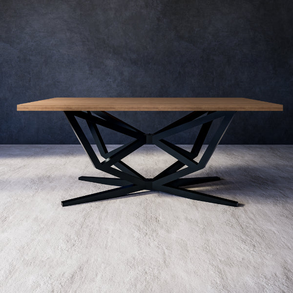 Dining table with wooden top and black metal base against a dark wall.