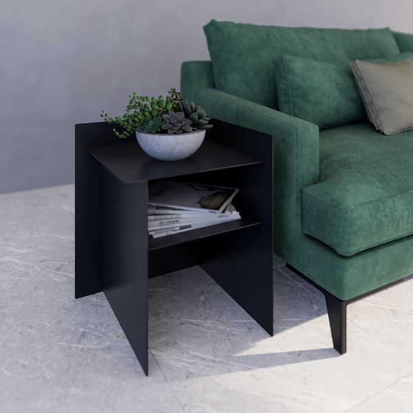 Connor Side Table (Left Hand) — Black side table with a plant and books next to a green sofa.