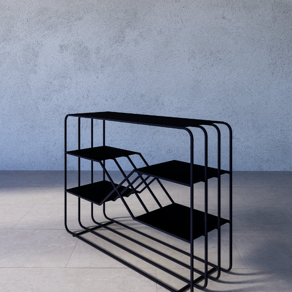 Emery console table – black metal shelf with multiple shelves against a gray concrete wall