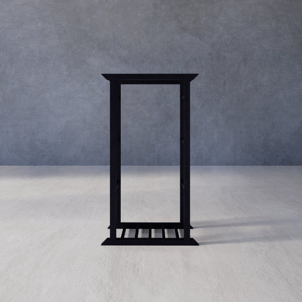 Secure Stacker Indoor Firewood Rack – black metal stand against a gray textured wall