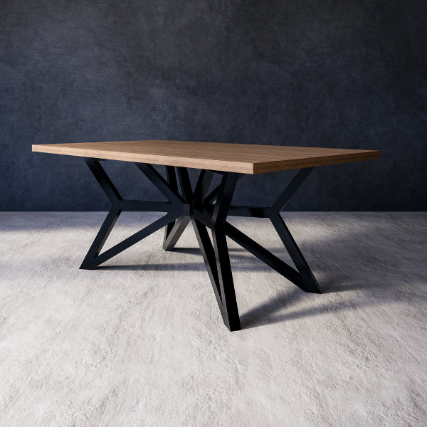 Seraphina dining table with wooden top and black metal legs on a gray floor with a dark wall background.