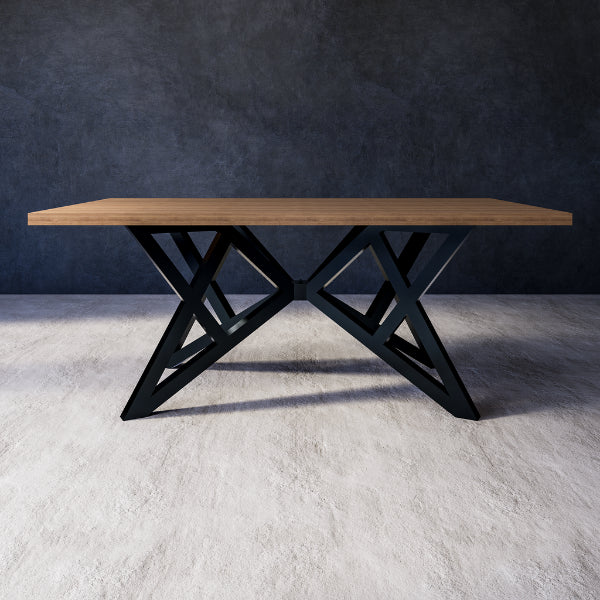 Ursa dining table with wooden top and black metal base against a grey wall