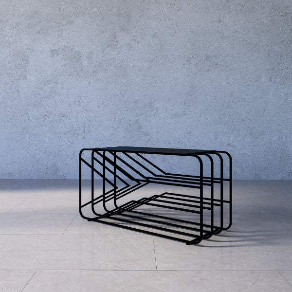 Zara shoe rack stand – modern black metal bench against a gray concrete wall